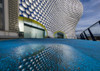 The Selfridges building reflected in a puddle. Poster Print by Loop Images Ltd. (19 x 13)