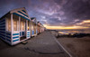 Beach huts on the promenade at Southwold. Poster Print by Loop Images Ltd. (18 x 11)