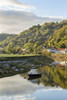 A small boat on the River Wye at Tintern. Poster Print by Loop Images Ltd. (12 x 18)