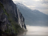 Geiranger Fjord in Norway with early morning mists. Poster Print by Loop Images Ltd. (17 x 13)