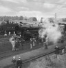 People standing and viewing the steam engine Evening Star on an open day; England Poster Print by John Short (16 x 16)