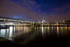 A view of the Millennium Bridge with St Paul's Cathedral in the distance. Poster Print by Loop Images Ltd. (18 x 12)