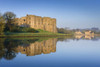 Carew Castle and mill pond. Poster Print by Loop Images Ltd. (18 x 12)