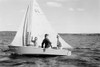 Historical image of three people sailing on Baptiste Lake in a sailboat, the woman waving at the camera, circa 1940; Athabasca County, Alberta, Canada Poster Print by Ian Grant (19 x 12)