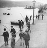 Edwardian boys playing and fishing on quayside Poster Print by John Short (16 x 16)