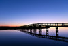 Boardwalk extending over the salt pond and marsh to the beach. Poster Print by Loop Images Ltd. (17 x 11)