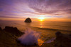 Splashing surf during a beautiful winter sunset at Cape Kiwanda looking south to Haystack Rock; Oregon, United States of America Poster Print by Craig Tuttle (17 x 11)