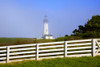 Yaquina Head Light in the fog with a white rail fence in the foreground; Newport, Oregon, United States of America Poster Print by Craig Tuttle (17 x 11)