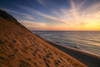 Sunrise paints the sky orange over the shoreline of Coastguard Beach; Cape Cod, Massachusetts, United States of America Poster Print by Michael Melford (17 x 11)