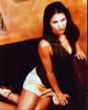 Charisma Carpenter On Couch In Skirt And Vest Photo Print (8 x 10)