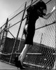 Liz Goldwyn In Leather Skirt Against Fence Black And White Photo Print (8 x 10)
