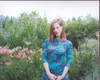 Liz Goldwyn  In Blue Dress In Front Of Flowers Photo Print (8 x 10)