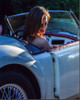 Liz Goldwyn In Convertible Looking Over Shoulder Photo Print (8 x 10)