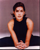 Teri Hatcher Sitting On Floor With Hands Together Photo Print (8 x 10)
