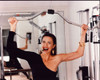 Lynda Carter In One Shoulder Top Exercising With Cigar In Mouth Photo Print (8 x 10)