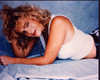 Erika Eleniak Laying On Stomach With Hand In Hair Photo Print (8 x 10)