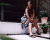 Delta Goodrem Sitting In Black And White Dress Photo Print (8 x 10)