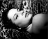Luciana Paluzzi Laying On Animal Fur Black And White Photo Print (8 x 10)