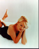 Portia De Rossi Laying On White Rug Photo Print (8 x 10)