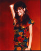 Tiffani Thiessen In Floral Dress With Arm Up Red Background Photo Print (8 x 10)