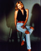 Kim Cattrall On Stool In Ripped Jeans And Black Halter Photo Print (8 x 10)