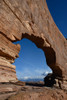 USA-Utah. Jeep Arch and clouds near Moab Poster Print - Howie Garber