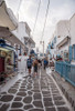 Colourful streets of Mykonos Poster Print - Mona Singh