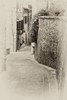 Italy- Umbria. Vintage look of a street in the historic town of Montone. Poster Print - Julie Eggers