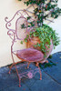 Italy-Tuscany-Lucca Decorative chair and potted plant outside a shop Piazza dellAnfiteatro Romano Poster Print - Julie Eggers # VARPDXEU16JEG1266