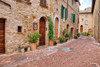 Italy-Tuscany-Pienza Flower pots and potted plants decorate a narrow street in a Tuscany village Poster Print - Julie Eggers # VARPDXEU16JEG1132