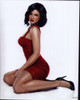 Gina Carano Sitting On Ground In Red Dress Photo Print - Item # MVM55359