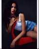 Nesta Cooper In Shorts On Red Chair Photo Print - Item # MVM58485