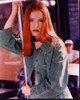 Alicia Witt Leaning On Pole In Green Jacket Photo Print - Item # MVM70181