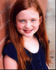 Sadie Sink Smiling Leaning On Brick Wall Photo Print