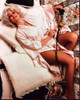 Dolly Parton Laying On Bed With Phone Photo Print - Item # MVM58089