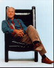 John Lithgow Sitting In Black Leather Chair Photo Print - Item # MVM59966