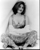 Gillian Anderson Sitting In Dress With Sweater Around Arms Black And White Photo Print - Item # MVM55478