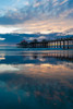 The Huntington Beach Pier and reflections on the wet beach at sunset Huntington Beach-California Poster Print - Sergio Pitamitz