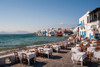 Restaurant tables on the seaside in the Little Venice neighborhood Chora-Mykonos Island-Greece Poster Print - Sergio Pitamitz