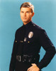 Adam-12 Man in Police Uniform Making Serious Face in Blue Background Photo Print - Item # VARCEL680770