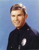 Adam-12 Posed in Police Officer Uniform with a Smile in a Portrait wish Blue Background Photo Print - Item # VARCEL680771