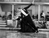Fred Astaire and Ginger Rogers Dancing in Black Dress and Black Tuxedo with Audience Watching Photo Print - Item # VARCEL680847