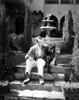 Fred Astaire Seated on Stairs in Black and White Photo Print - Item # VARCEL681010