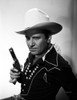 Gene Autry Posed in Cowboy Outfit and Holding Gun Photo Print - Item # VARCEL681177