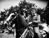 Gene Autry Riding a Horse with Trees on Background Photo Print - Item # VARCEL681185