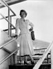 Lucille Ball standing on Stair, wearing White Dress Photo Print - Item # VARCEL681302