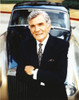 Gene Barry in Black Suit Leaning on Car Photo Print - Item # VARCEL681373