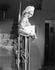 Joan Bennett leaning on a stair rail Photo Print - Item # VARCEL681915