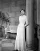 Ingrid Bergman Leaning on a Post in a White Dress Photo Print - Item # VARCEL681953