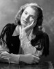 Ingrid Bergman wearing a White Long Sleeve Blouse and Face Leaning on Hand Photo Print - Item # VARCEL681984